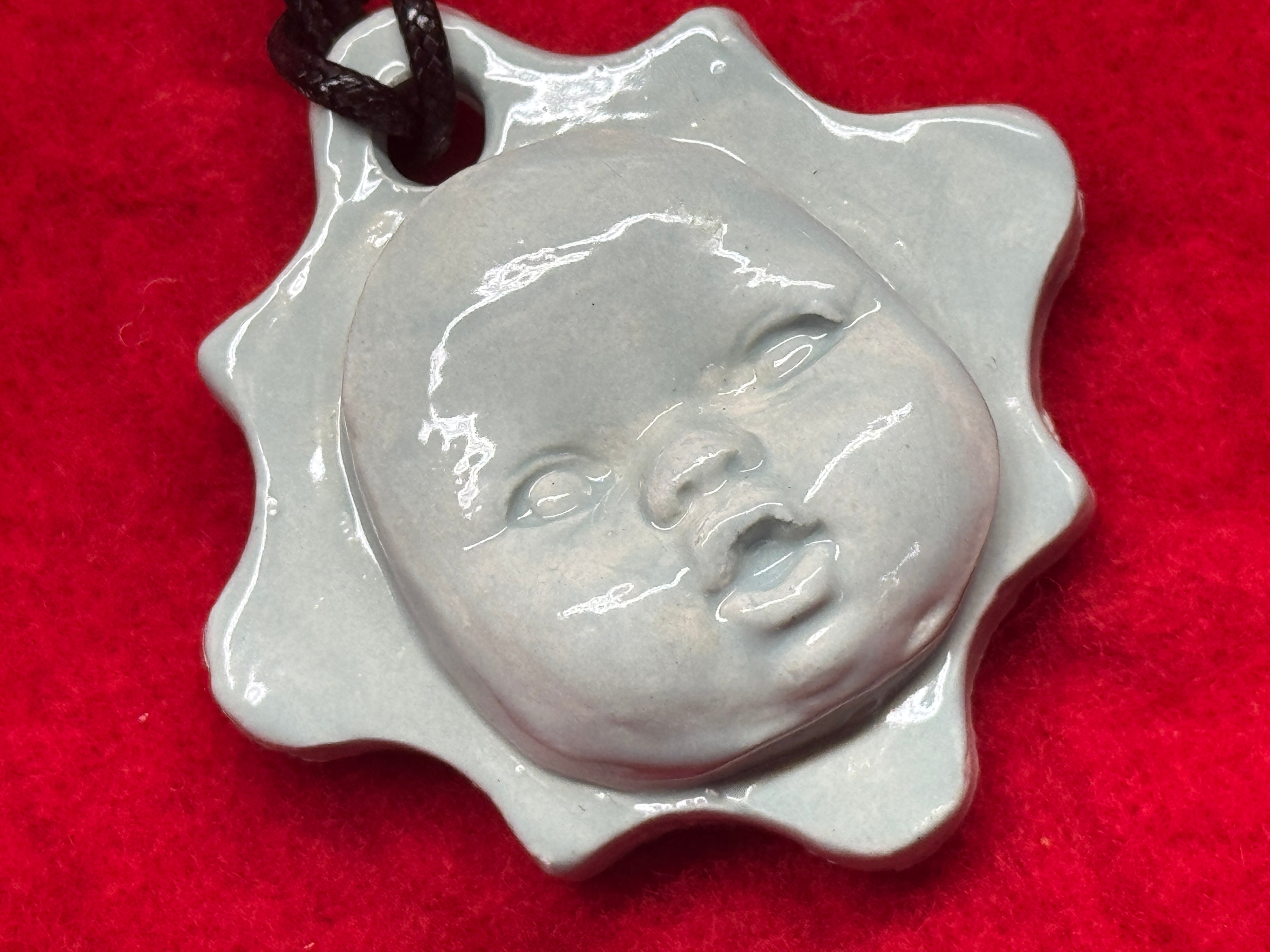 baby face necklace - baby blue
