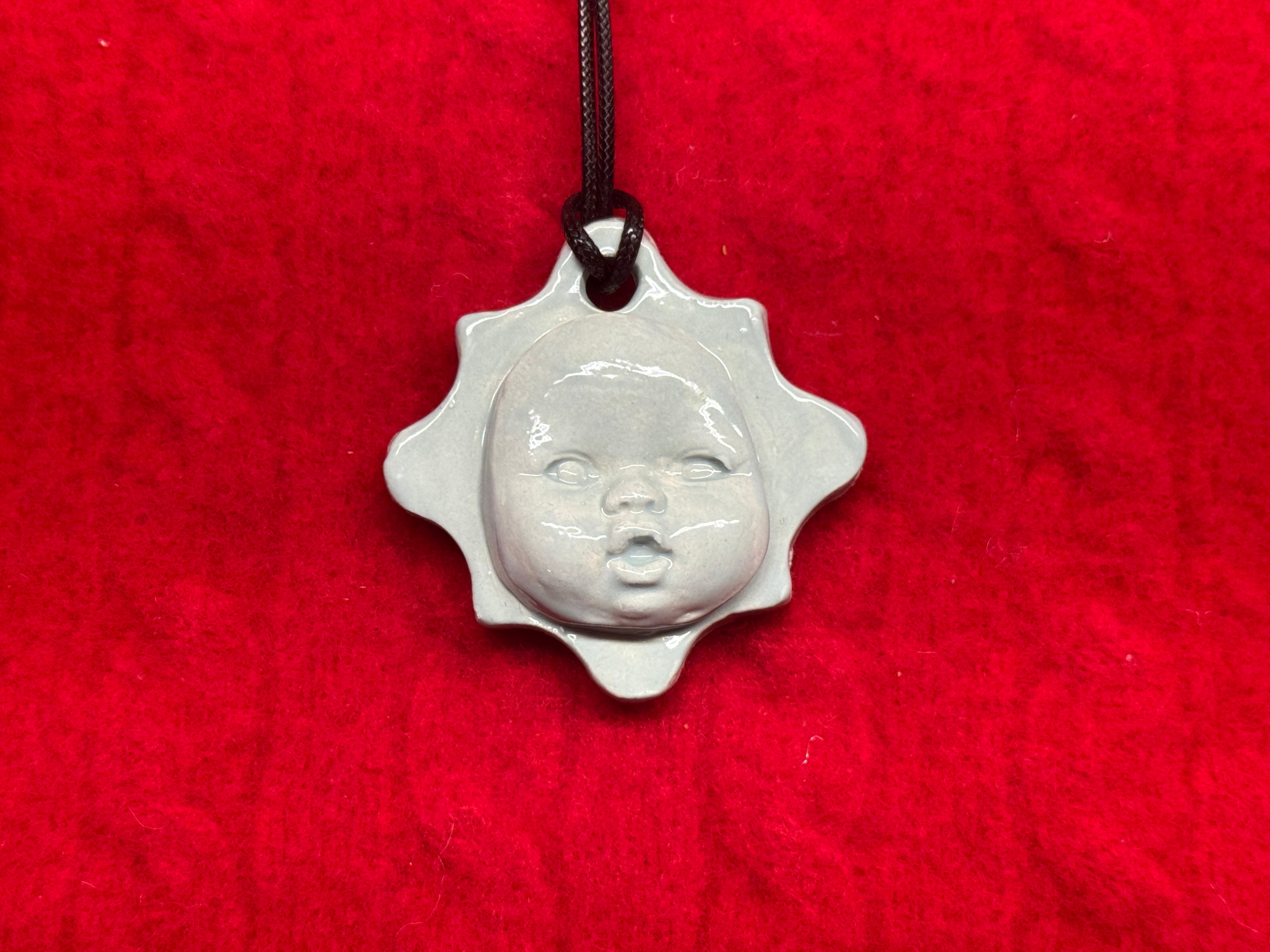 baby face necklace - baby blue