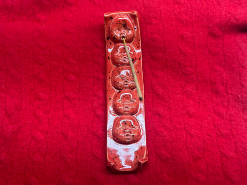 baby face incense holder - red & black