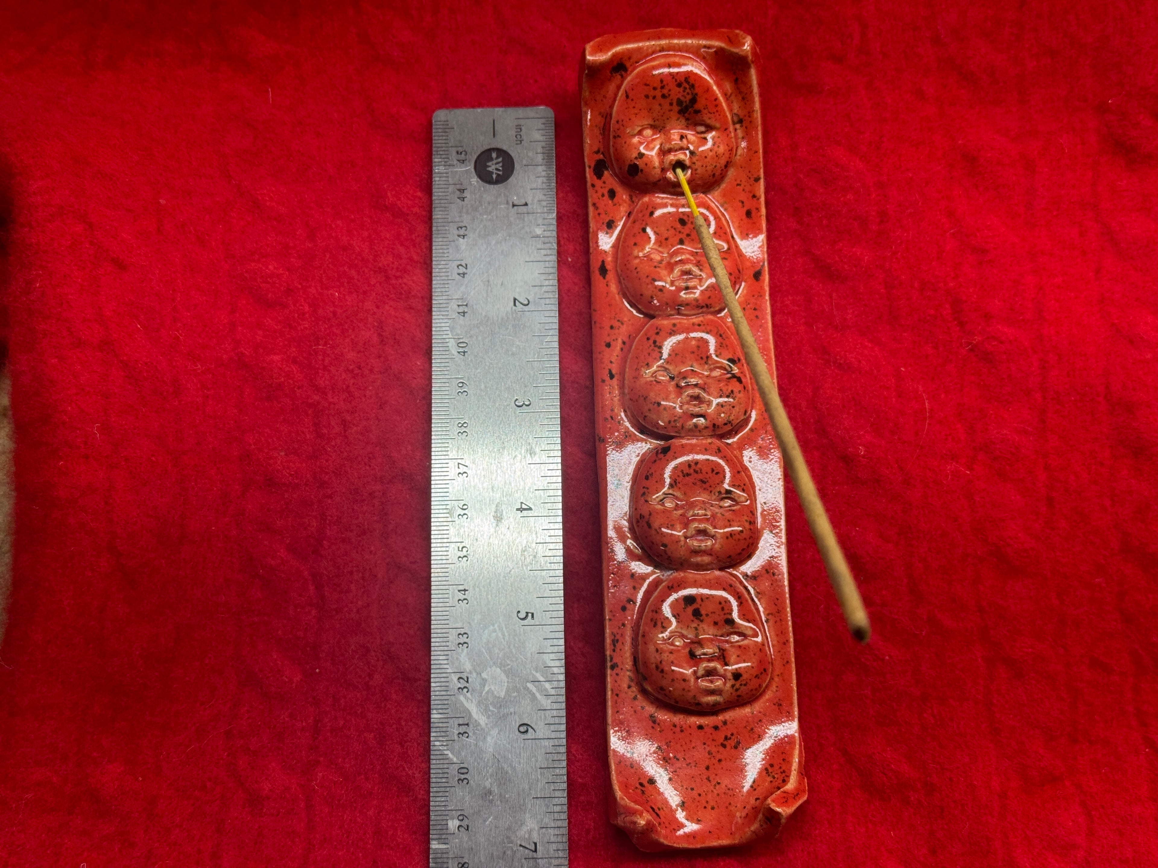 baby face incense holder - red & black