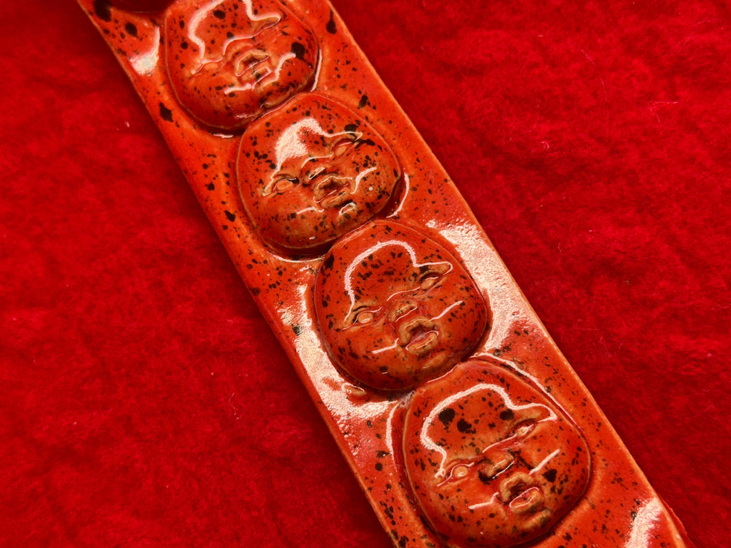 baby face incense holder - red & black