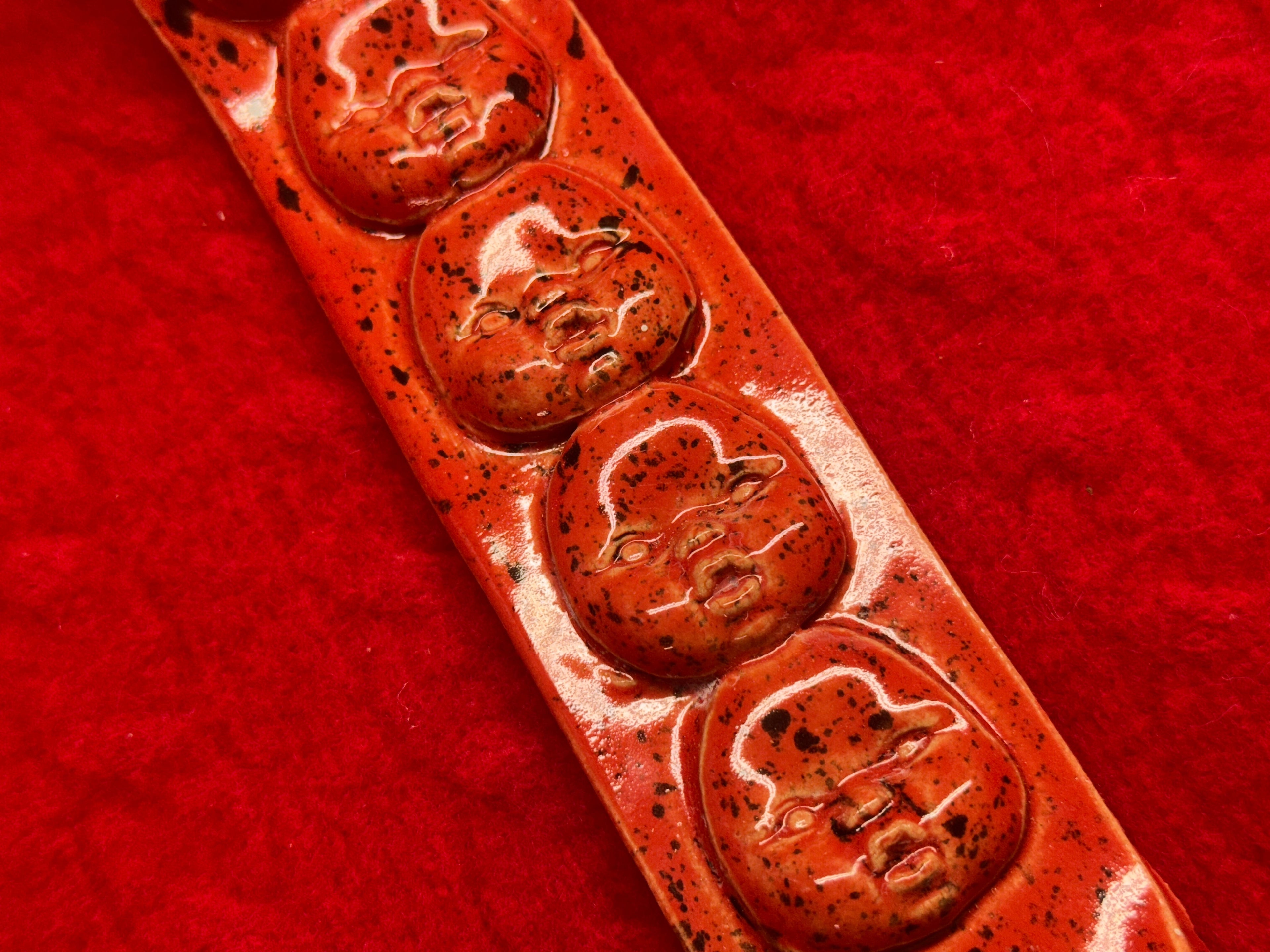 baby face incense holder - red & black