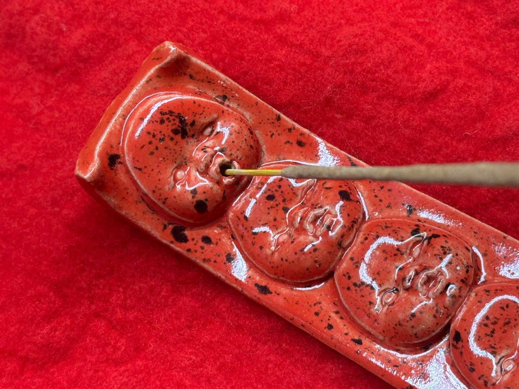 baby face incense holder - red & black