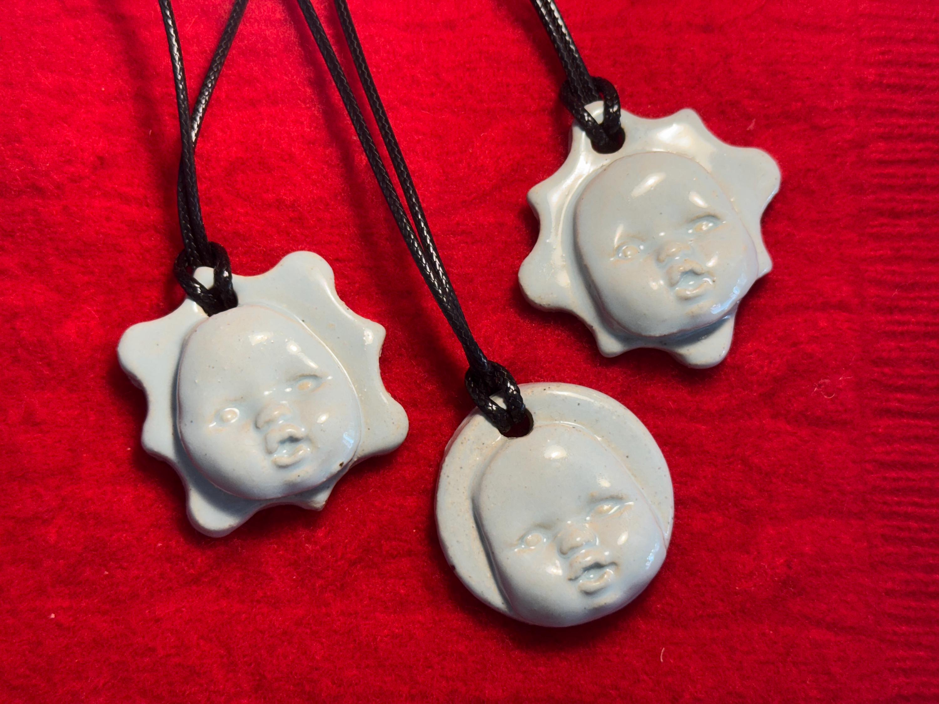 baby face necklace - baby blue